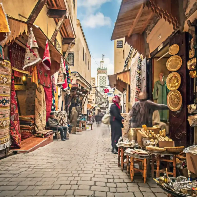 Shops and crowds in Jemaa el-Fnaa square, Marrakech medina, Morocco, Free things to do in Marrakech | Medina & Souks. Visit Morocco Tours