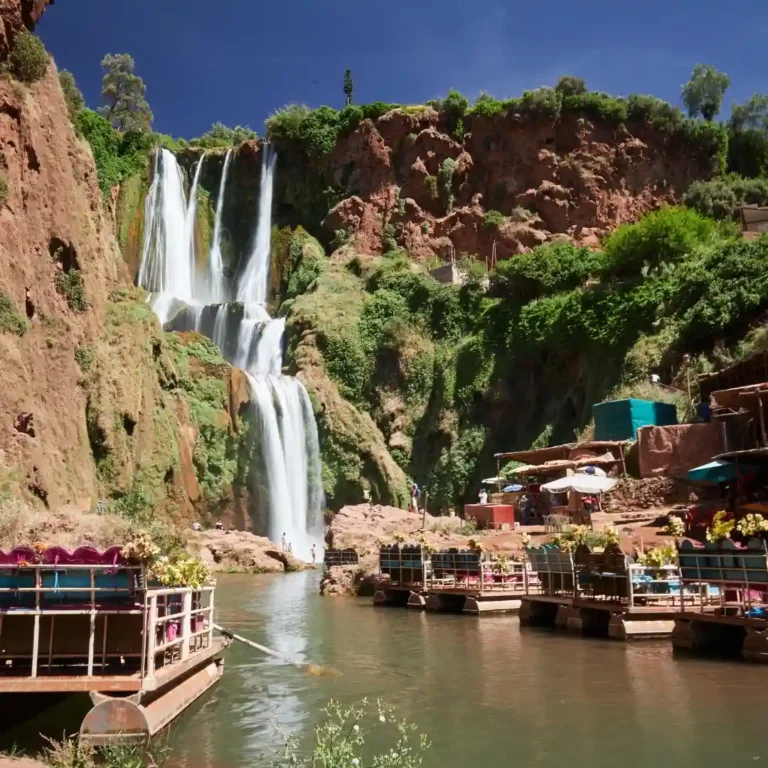 Ouzoud Waterfalls cascading in lush green surroundings. Visit Morocco Tours
