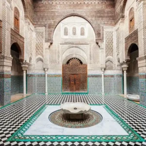 Free things to do in Fez | Al Attarine Madrasa with mosaic tile, carved cedar, and a peaceful courtyard. Visit Morocco Tours