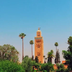 Free things to do in Marrakech | Koutoubia Mosque with palm trees on a bright day. Visit Morocco Tours