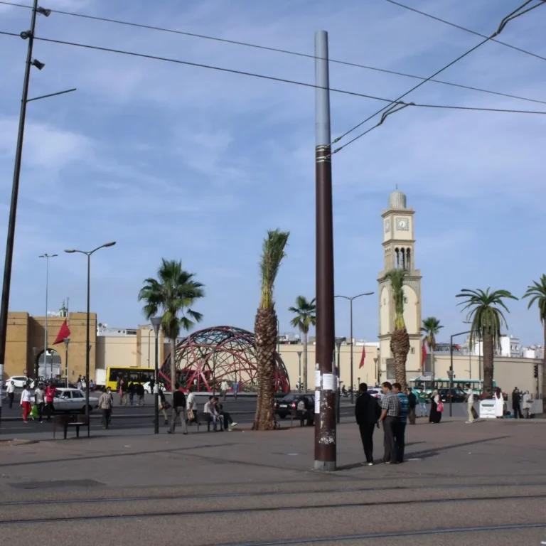 Free things to do in Casablanca | United Nations Square with iconic red metal sculpture and historic buildings. Visit Morocco Tours