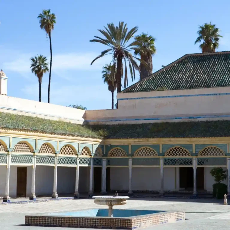 Beautiful courtyard and intricate architecture at Bahia Palace in Marrakech Morocco. Visit Morocco Tours