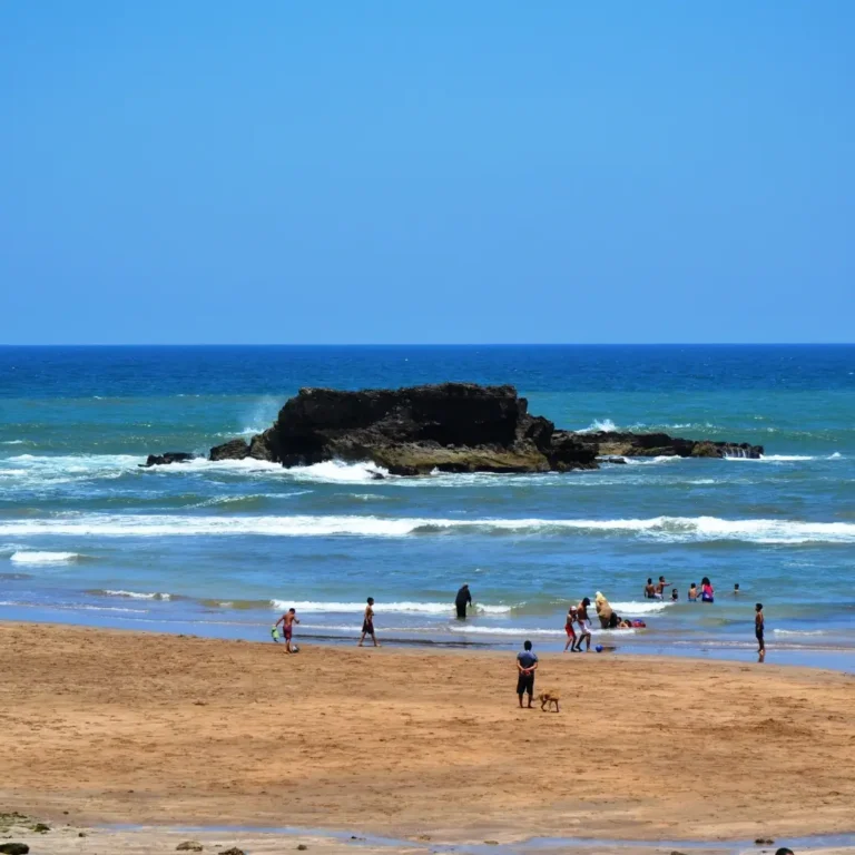Sandy Atlantic beach coastline with city views in Casablanca, Morocco. Visit Morocco Tours