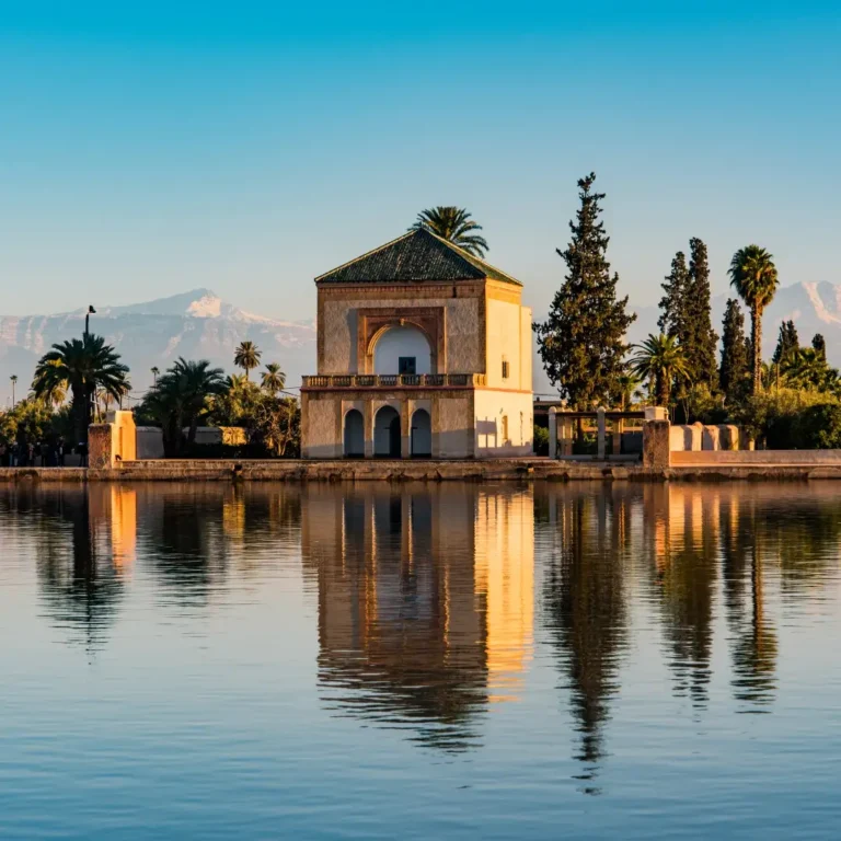 Historic Saadian pavilion at Menara Gardens with Atlas Mountains background Marrakech. Visit Morocco Tours