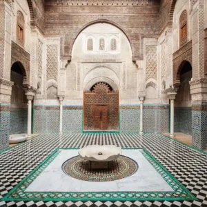 Al-Attarine Madrasa Guided Tour: interior with zellij and carved wood. Visit Morocco Tours