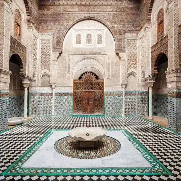 Al-Attarine Madrasa Guided Tour: interior with zellij and carved wood. Visit Morocco Tours