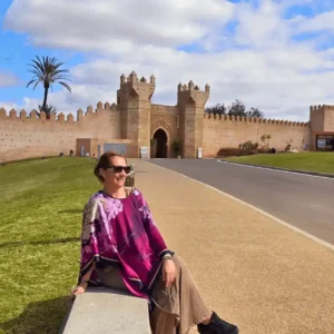 A traveler explores the historic Chellah ruins in Rabat on a cultural Morocco tour with Visit Morocco Tours.