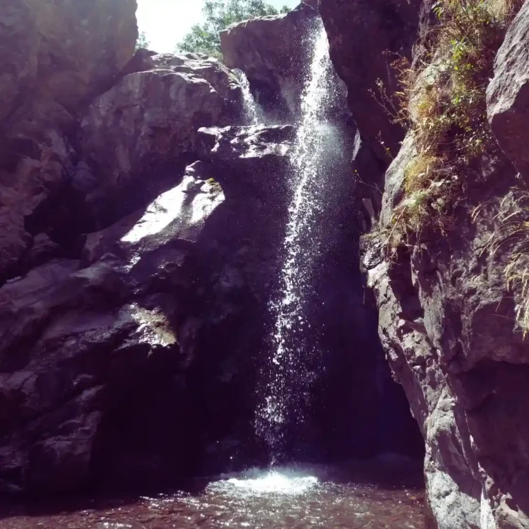 Visit Morocco Tours - Scenic waterfall hike in the Imlil Valley, High Atlas Mountains, Morocco.