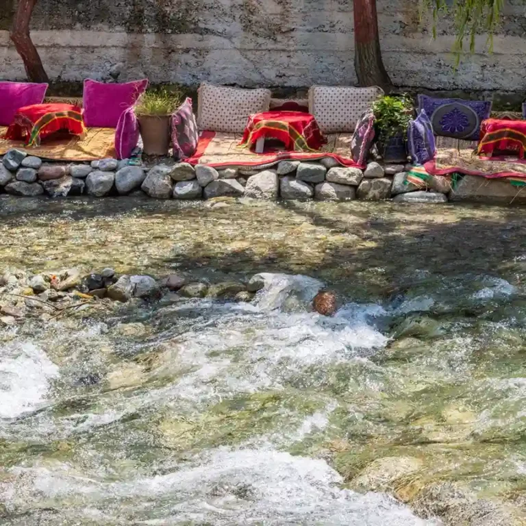Visit Morocco Tours - Authentic riverside dining experience in the Ourika Valley, Morocco.