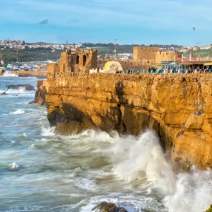 The dramatic cliffs and powerful Atlantic Ocean waves crashing on the coast of Safi, Morocco. Visit Morocco Tours