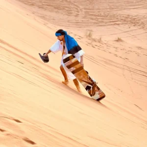 Sandboarding with rental Merzouga- down Erg Chebbi dunes with Visit Morocco Tours