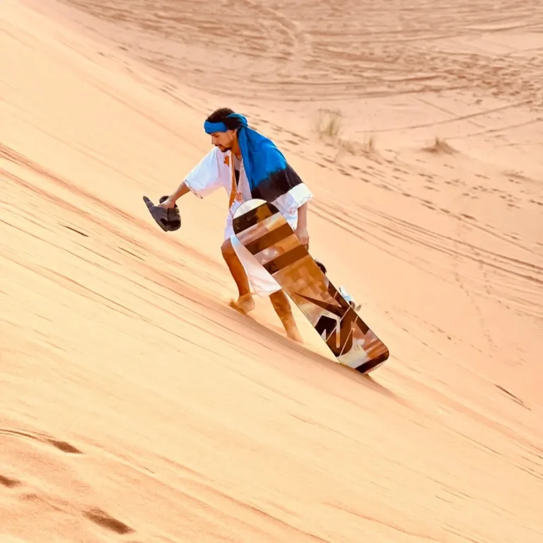 Sandboarding with rental Merzouga- down Erg Chebbi dunes with Visit Morocco Tours