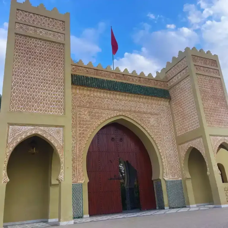 The ornate entrance and courtyard of the Mausoleum of Moulay Ali Cherif, founder of the Alaouite dynasty, in Rissani, Morocco. Visit Morocco Tours